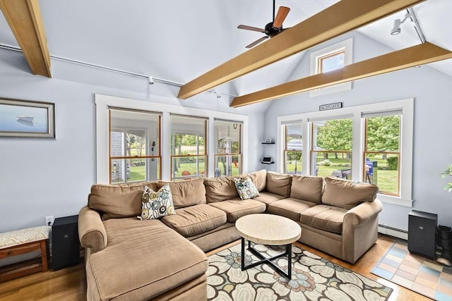 112 Hollett St, Scituate, MA 02066 - living area with wood finished floors, a baseboard heating unit, rail lighting, and ceiling fan