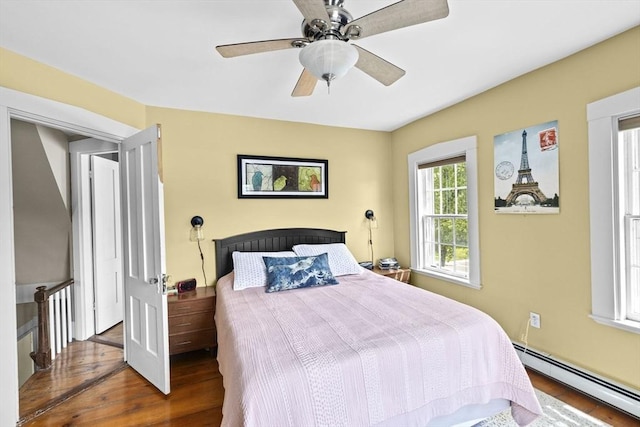 112 Hollett St, Scituate, MA 02066 - bedroom with a baseboard radiator, wood finished floors, and ceiling fan