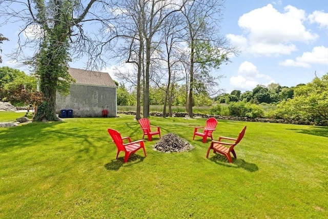 112 Hollett St, Scituate, MA 02066 - view of grassy yard with an outdoor fire pit