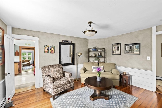 112 Hollett St, Scituate, MA 02066 - living area with light wood finished floors and baseboard heating