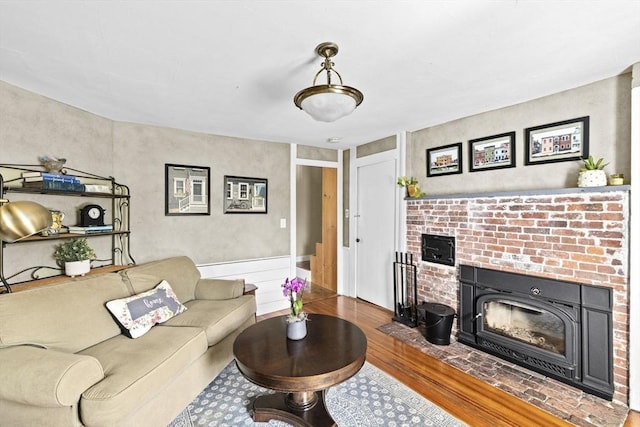 112 Hollett St, Scituate, MA 02066 - living room with wood finished floors and a brick fireplace