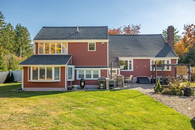 back of house with a wooden deck and a yard