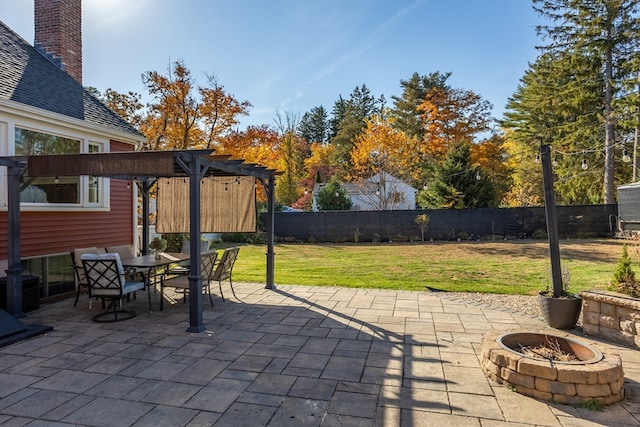 view of patio featuring an outdoor fire pit and a pergola