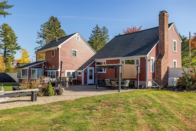 back of house featuring a yard and a patio area