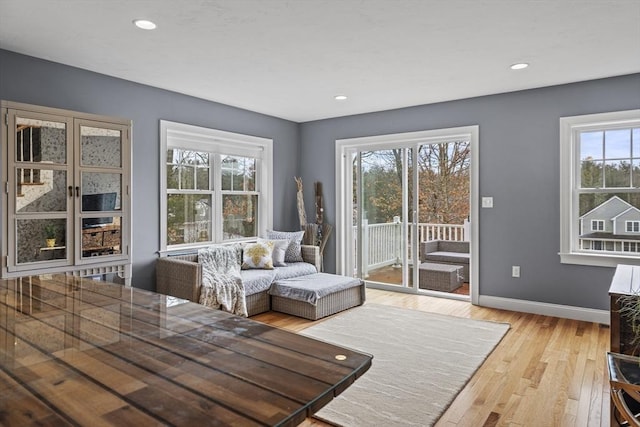 unfurnished dining area featuring recessed lighting, baseboards, and light wood-style flooring