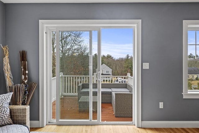 entryway featuring wood finished floors and baseboards