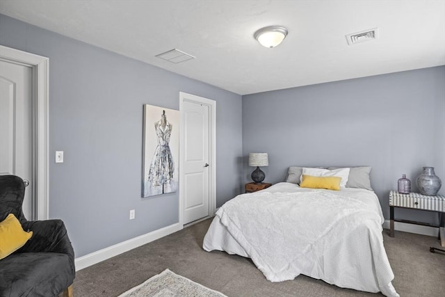 carpeted bedroom with visible vents and baseboards