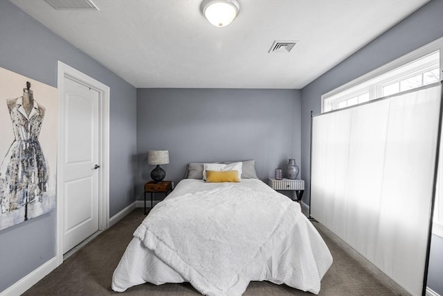 bedroom featuring visible vents, baseboards, and carpet floors