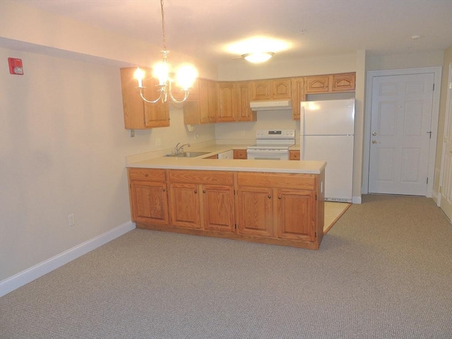 kitchen with sink, light colored carpet, white appliances, and kitchen peninsula