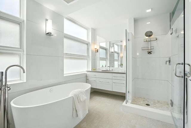 91 Kirkland St Unit 91, Cambridge, MA 02138 - full bathroom with a shower stall, vanity, and a soaking tub