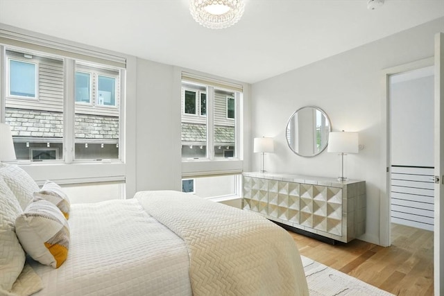 91 Kirkland St Unit 91, Cambridge, MA 02138 - bedroom featuring light wood-type flooring and multiple windows