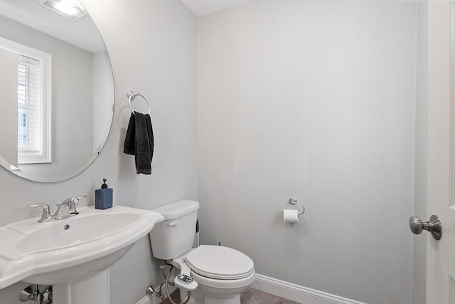 bathroom with toilet and sink