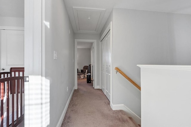 hallway featuring light carpet