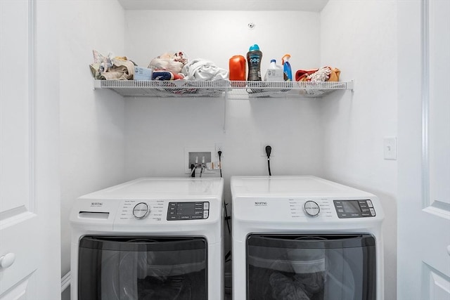 laundry area with separate washer and dryer