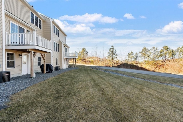 view of yard with a wooden deck and cooling unit