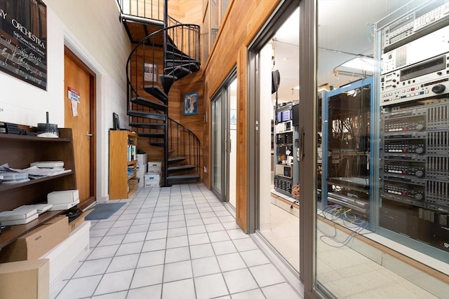 corridor featuring light tile patterned floors