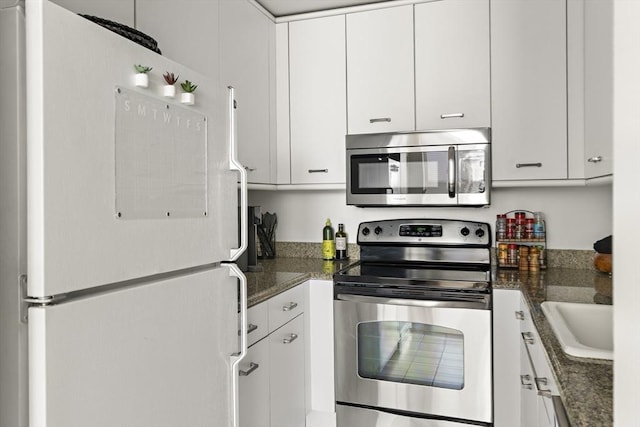 416 Marlborough St Unit 504, Boston, MA 02115 - kitchen featuring white cabinets, stainless steel appliances, and a sink