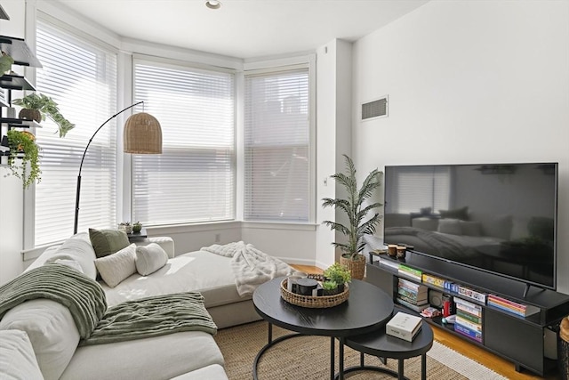 416 Marlborough St Unit 504, Boston, MA 02115 - living area featuring a healthy amount of sunlight, wood finished floors, and visible vents