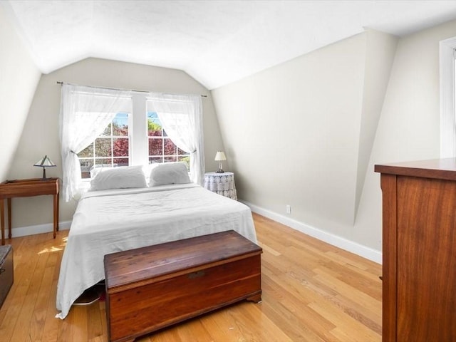 151 Pilgrim Rd, Weymouth, MA 02191 - bedroom featuring light wood finished floors, lofted ceiling, and baseboards
