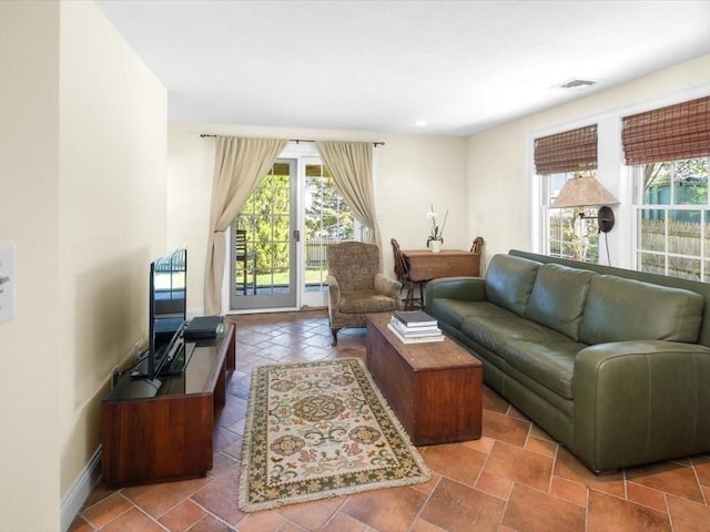 151 Pilgrim Rd, Weymouth, MA 02191 - living area featuring baseboards