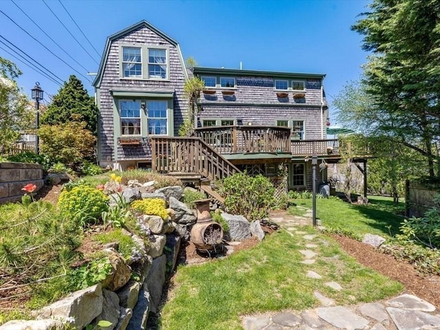 151 Pilgrim Rd, Weymouth, MA 02191 - back of property featuring a wooden deck, a lawn, and stairway