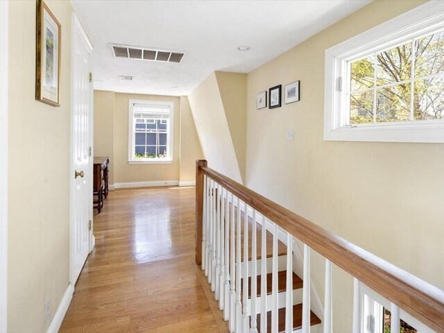 151 Pilgrim Rd, Weymouth, MA 02191 - hall with light wood-style floors, plenty of natural light, an upstairs landing, and baseboards