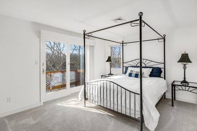 bedroom with access to outside, baseboards, visible vents, and carpet