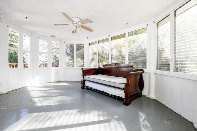 sunroom / solarium with ceiling fan, a healthy amount of sunlight, and a jacuzzi