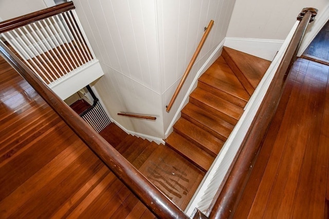 staircase featuring hardwood / wood-style flooring