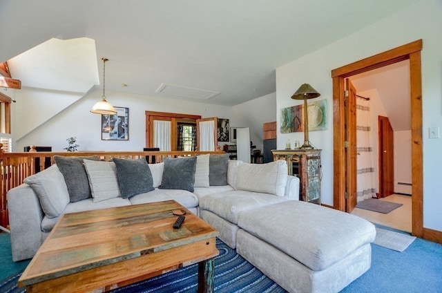 carpeted living room with baseboard heating and vaulted ceiling