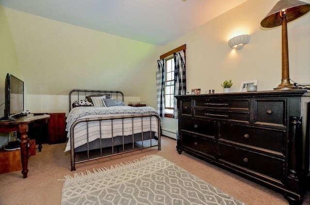 bedroom with light carpet, a baseboard radiator, and vaulted ceiling