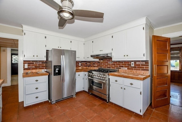 kitchen with tasteful backsplash, butcher block countertops, white cabinetry, ceiling fan, and stainless steel appliances