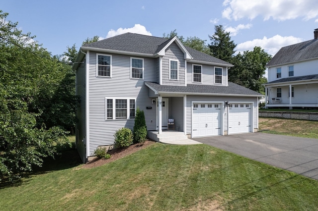 view of front facade with a front lawn and a garage