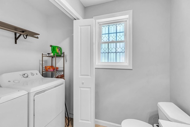 laundry room featuring washer and clothes dryer