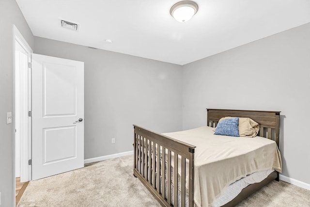 bedroom with light carpet