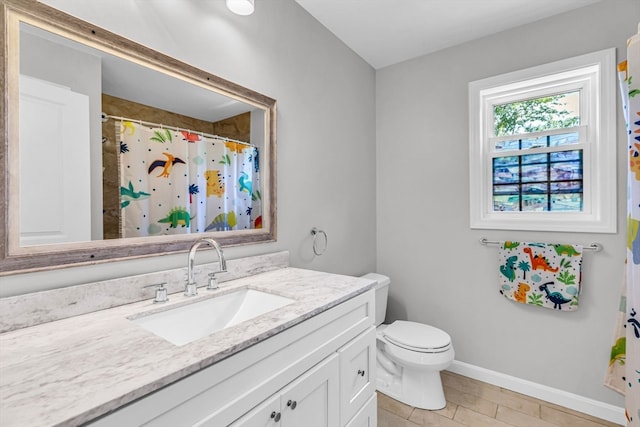 bathroom with vanity, tile patterned floors, toilet, and a shower with shower curtain