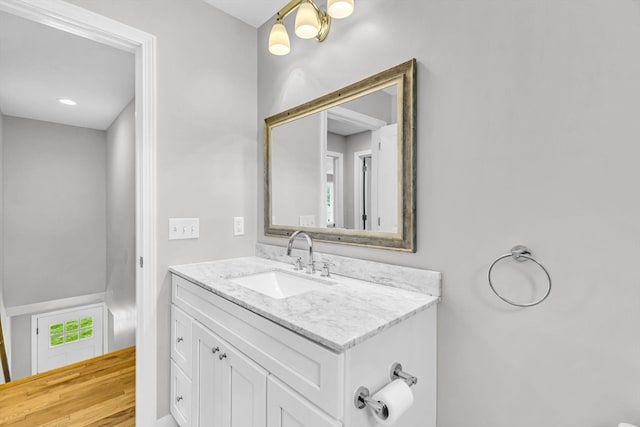 bathroom featuring hardwood / wood-style floors and vanity