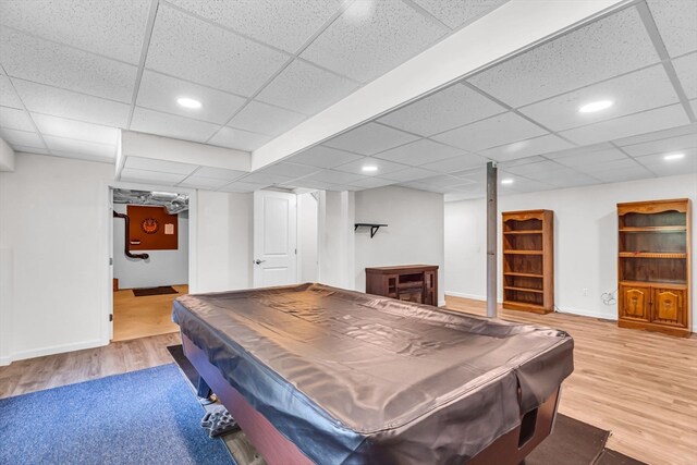 playroom with a paneled ceiling, pool table, and light hardwood / wood-style floors