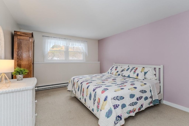 bedroom with carpet, baseboards, and baseboard heating