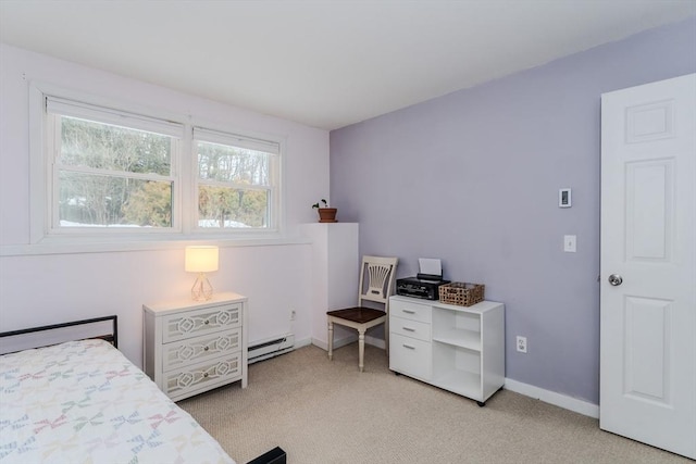 bedroom featuring light carpet, baseboard heating, and baseboards