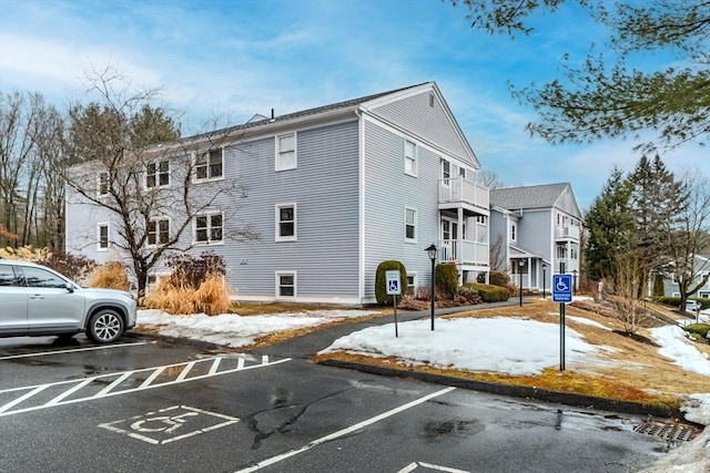 exterior space with uncovered parking and a residential view