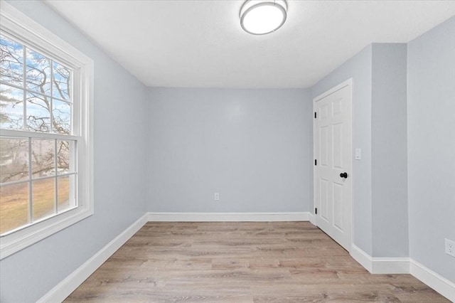 spare room with light wood-type flooring