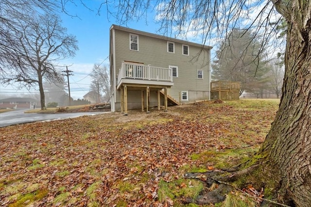 rear view of house with a wooden deck