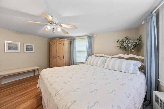 bedroom with wood finished floors and ceiling fan