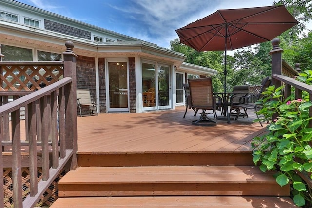 wooden deck with outdoor dining area