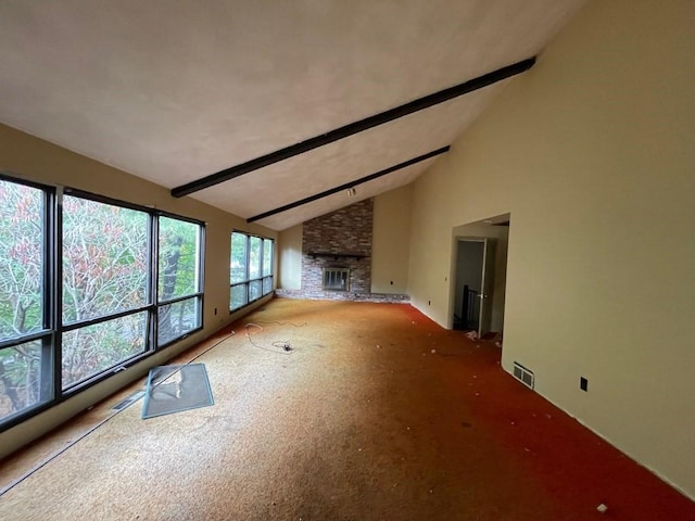 65 Beacon St, Melrose, MA 02176 - unfurnished living room with beamed ceiling, a fireplace, and high vaulted ceiling