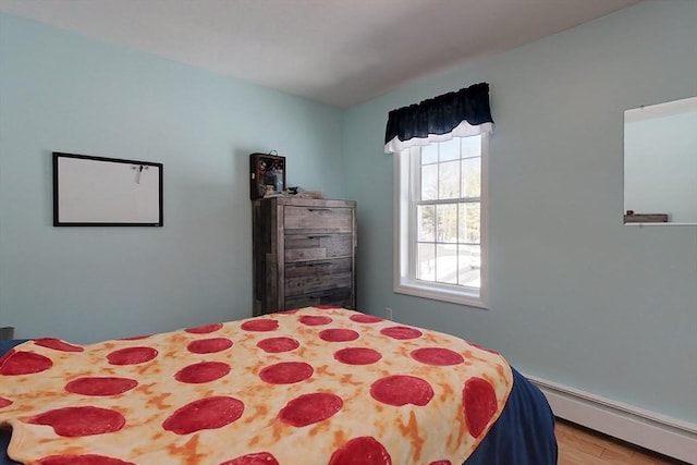 bedroom with a baseboard heating unit