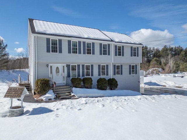 colonial inspired home featuring entry steps