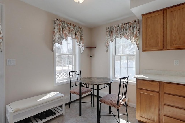 dining room featuring light tile patterned floors and baseboards