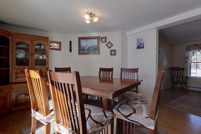 dining area with wood finished floors